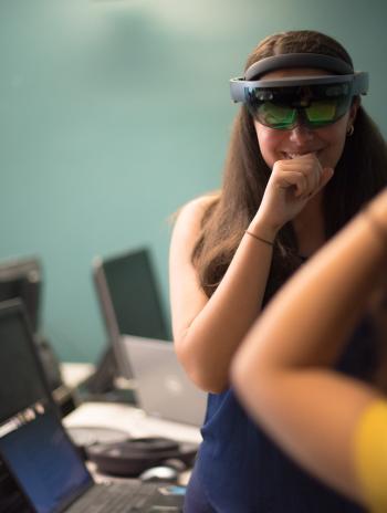student interns with Microsoft HoloLens