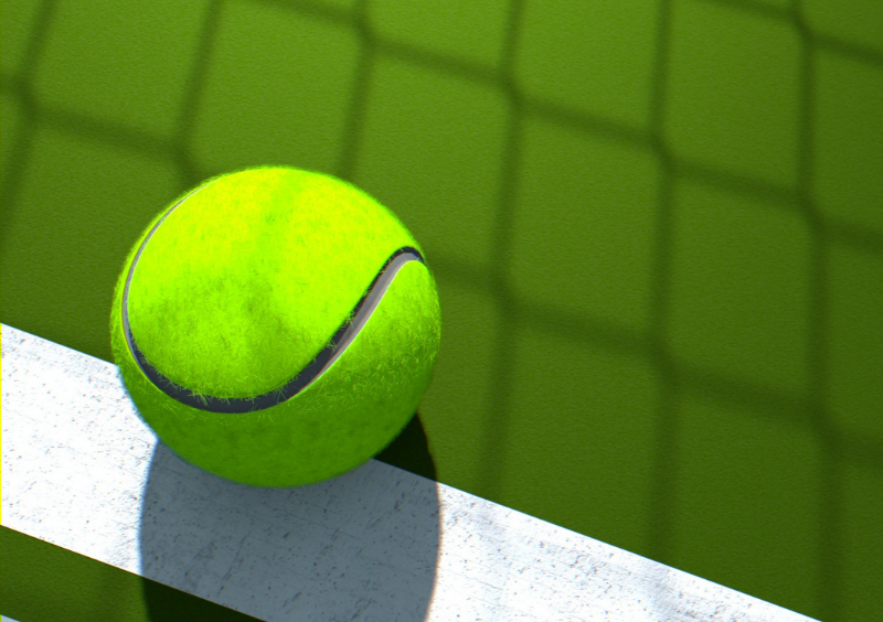 Image of a tennis ball on a tennis court