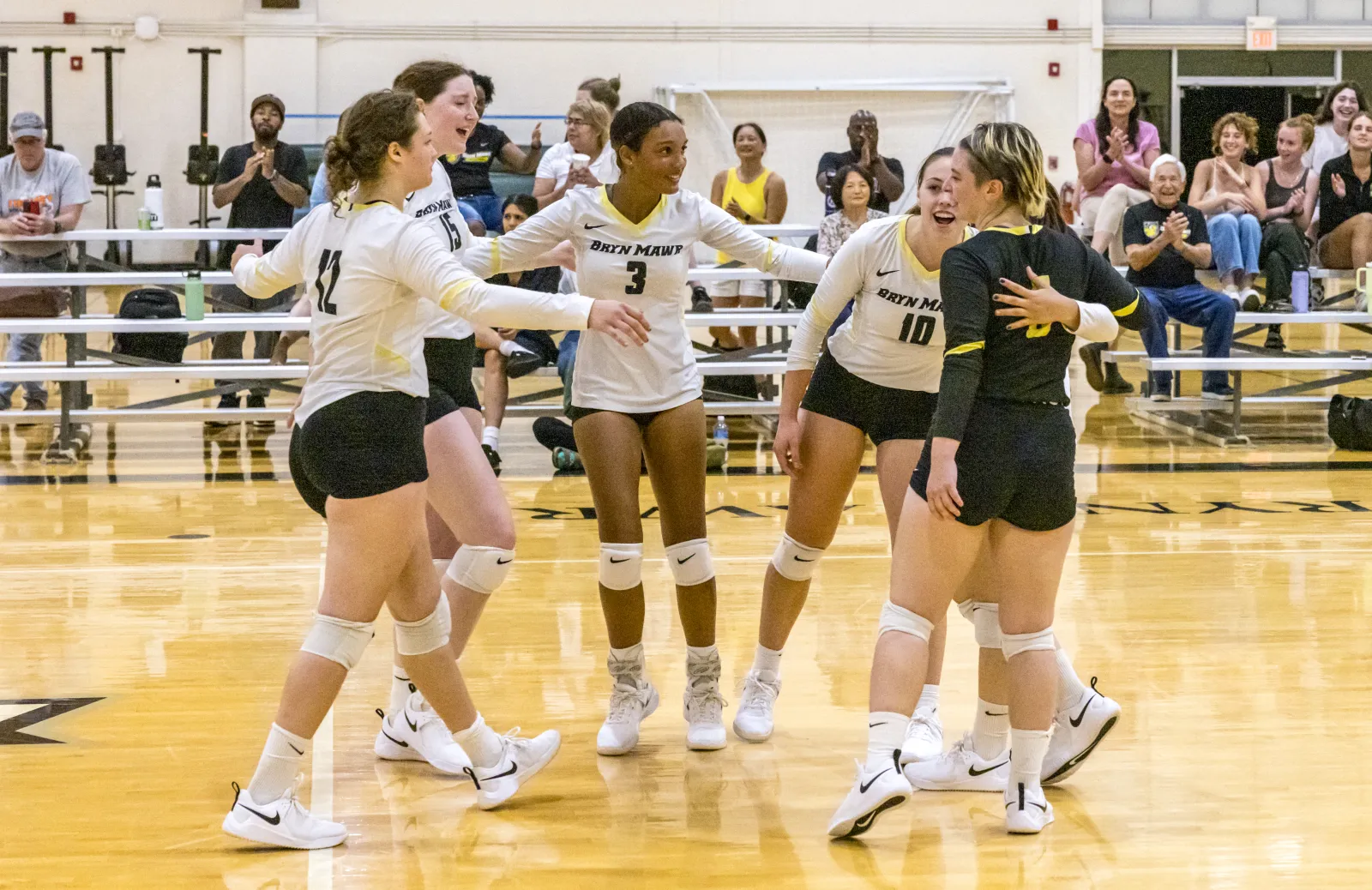 student athletes on a wooden court
