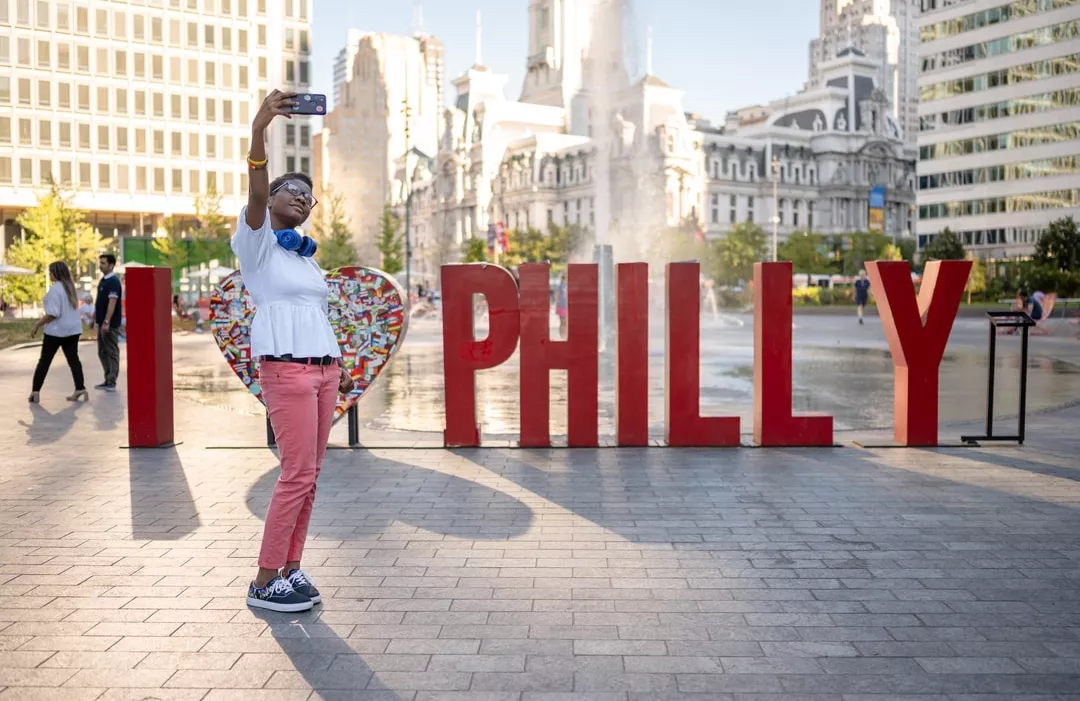 person taking selfie at Philadelphia's love park