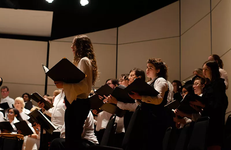 Student singing in a Bi-Co Chorale concert