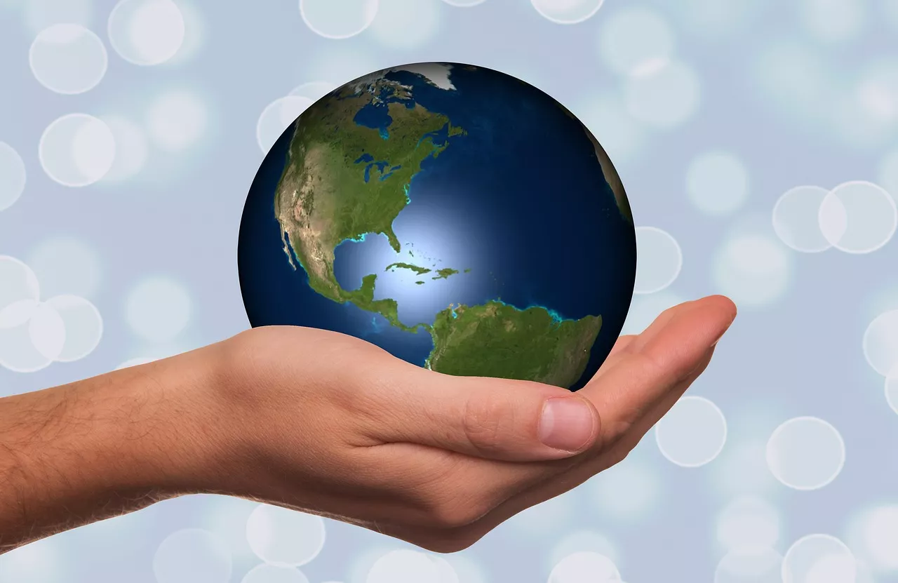 Hand holding a globe