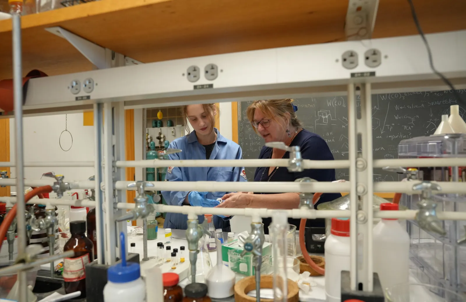 student and faculty in lab