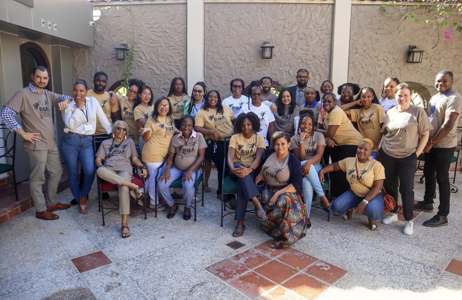 Moss standing with participants in the RGA Program