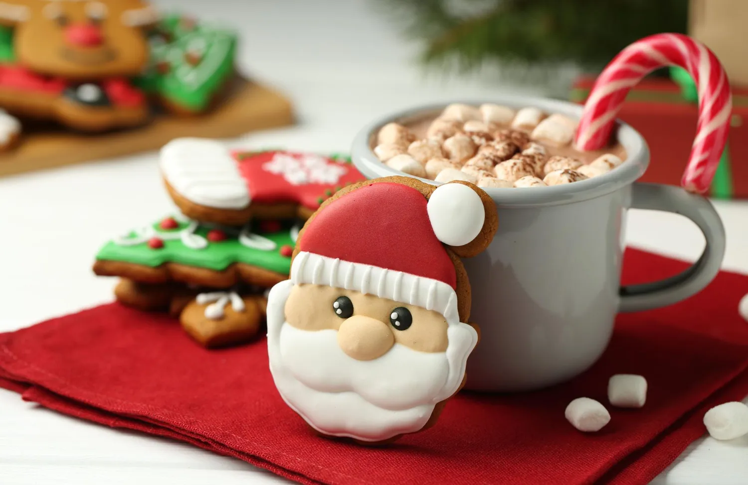 santa cookie with coffee and candy cane stock image