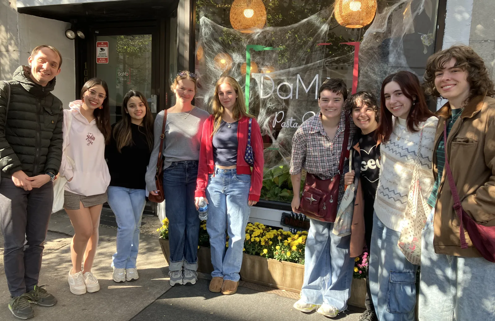 Students outside a restaurant on an Italian field trip