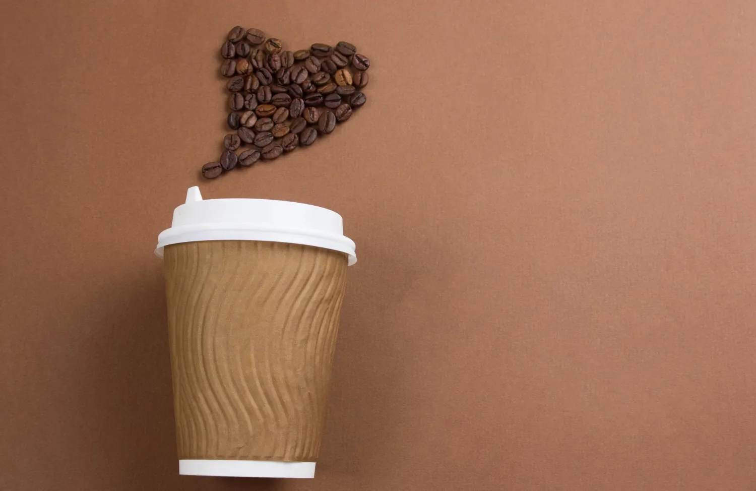 To go coffee with beans shaped in heart