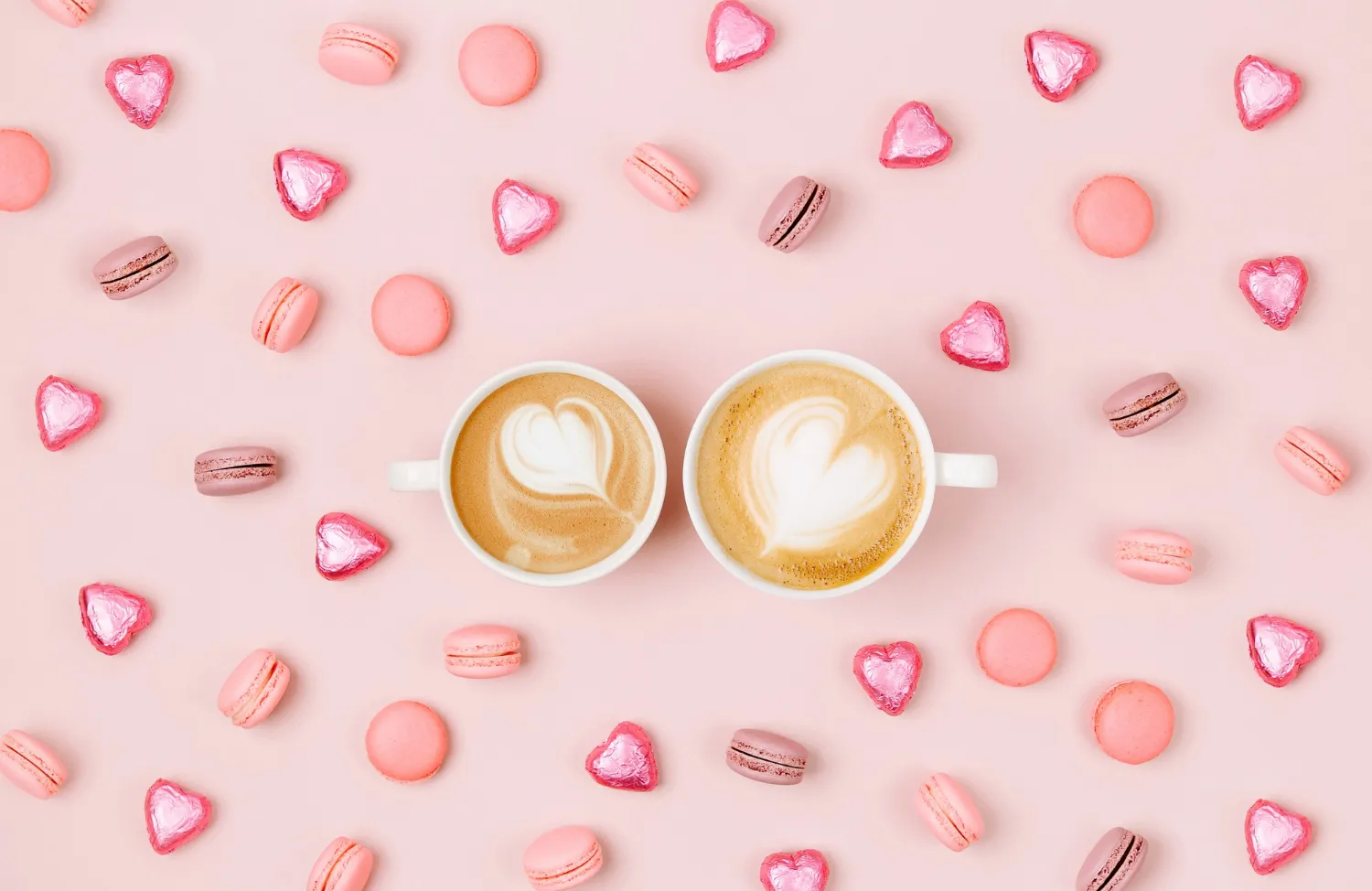 coffee-cups-with-candys-macaroons-pale-pink-background