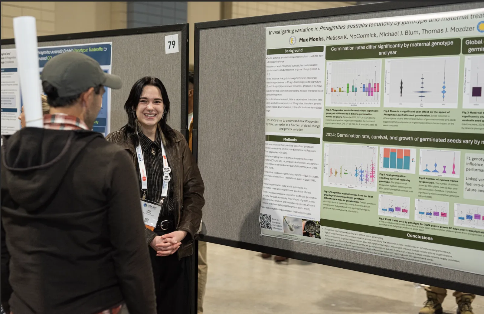 Max Monks presenting poster at conference 2025