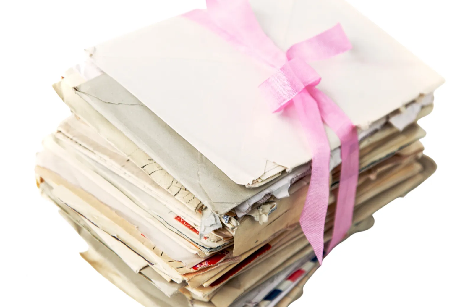 Stack of letters tied with a pink ribbon.