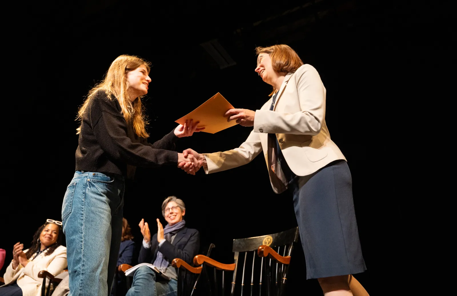 Wendy handing a student an award