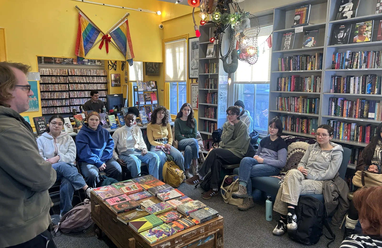 Students sitting inside bookstore.
