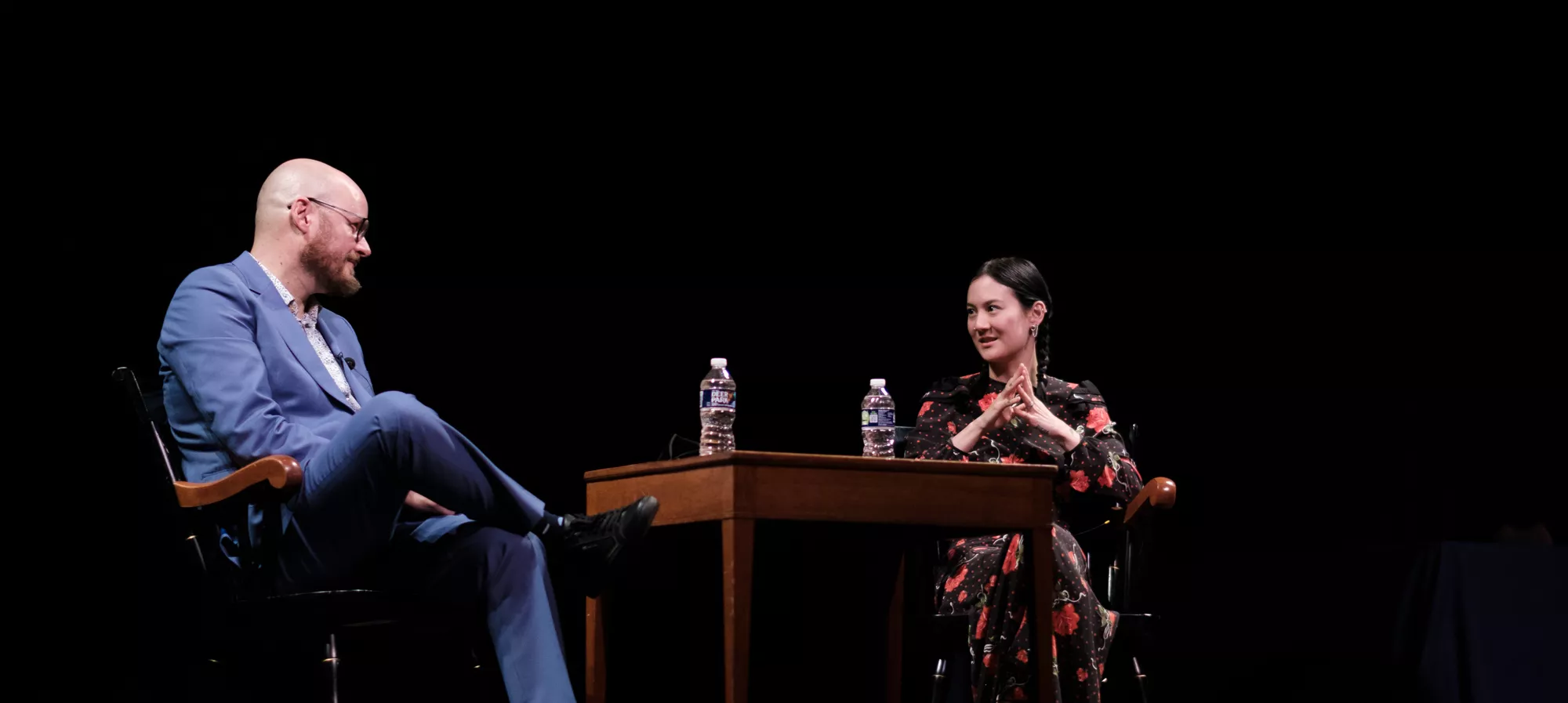 Michelle Zauner '11 (right) and Professor Daniel Torday on stage at Goodhart Hall.