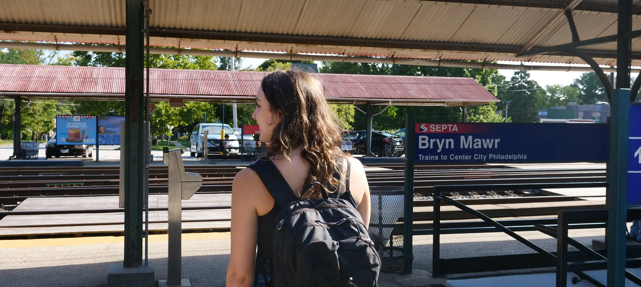 student waits for a train