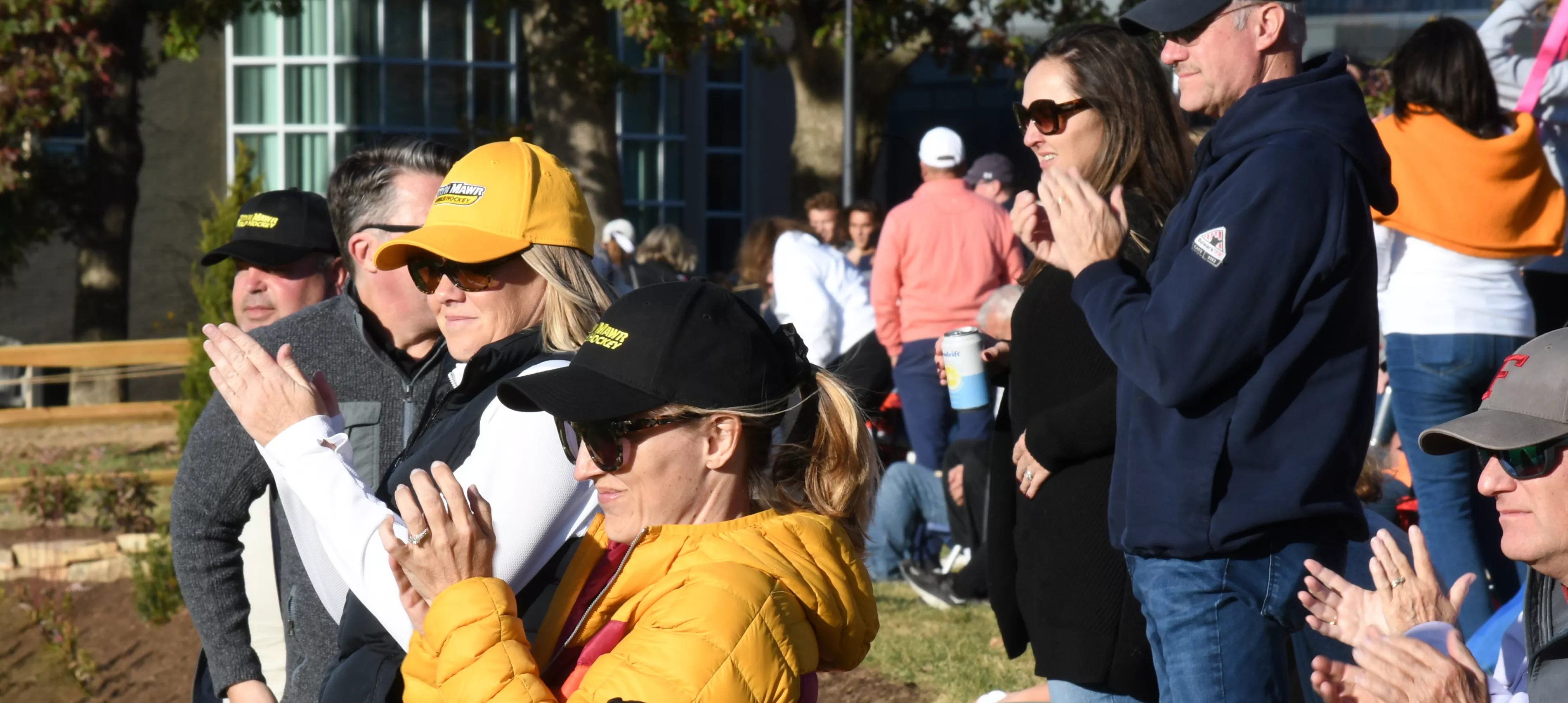 Families cheering on the Field Hockey team