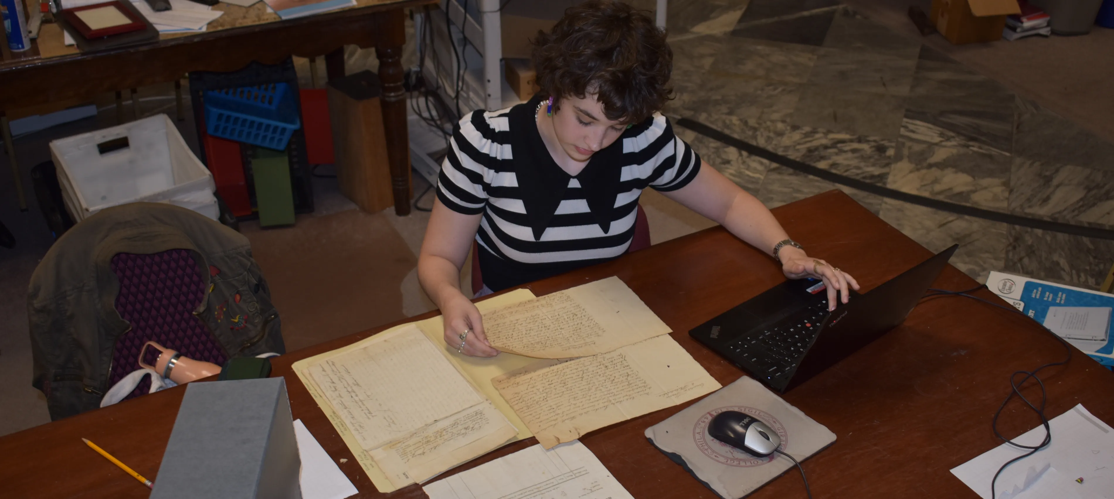 Vivian looking at historical documents