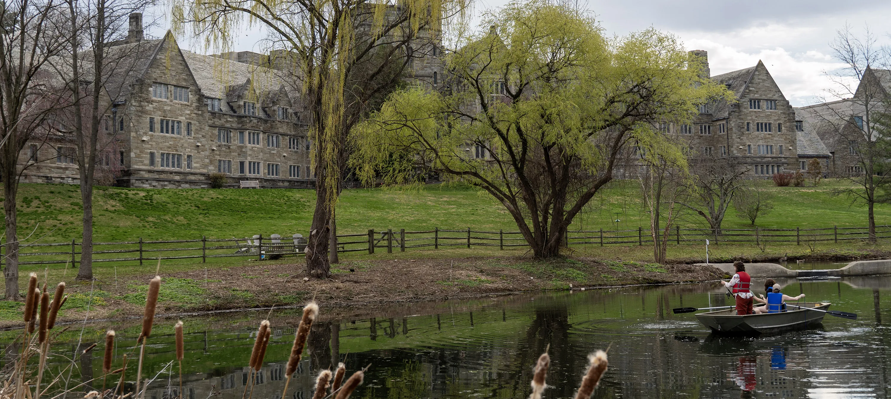 student in a boat on a lake