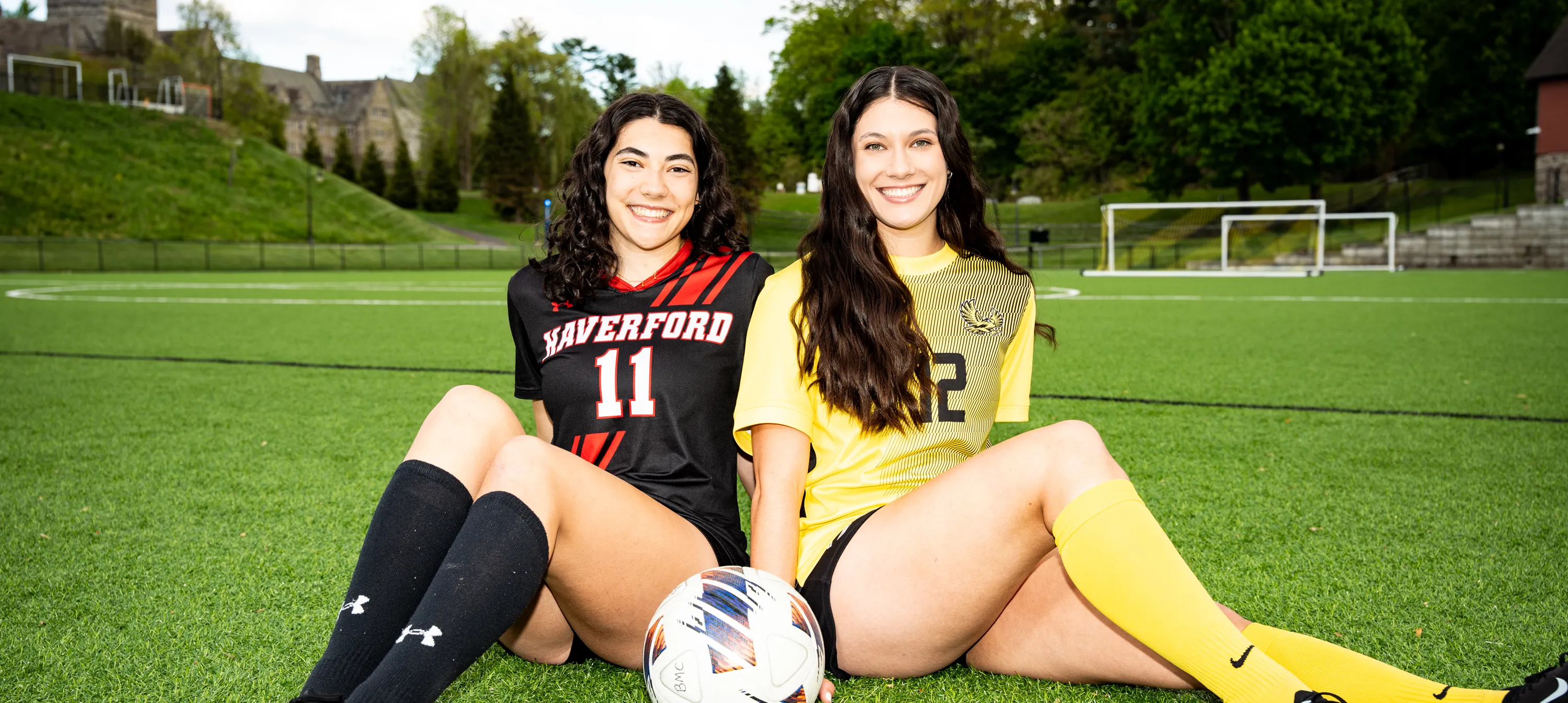 Twin sisters with a soccer ball