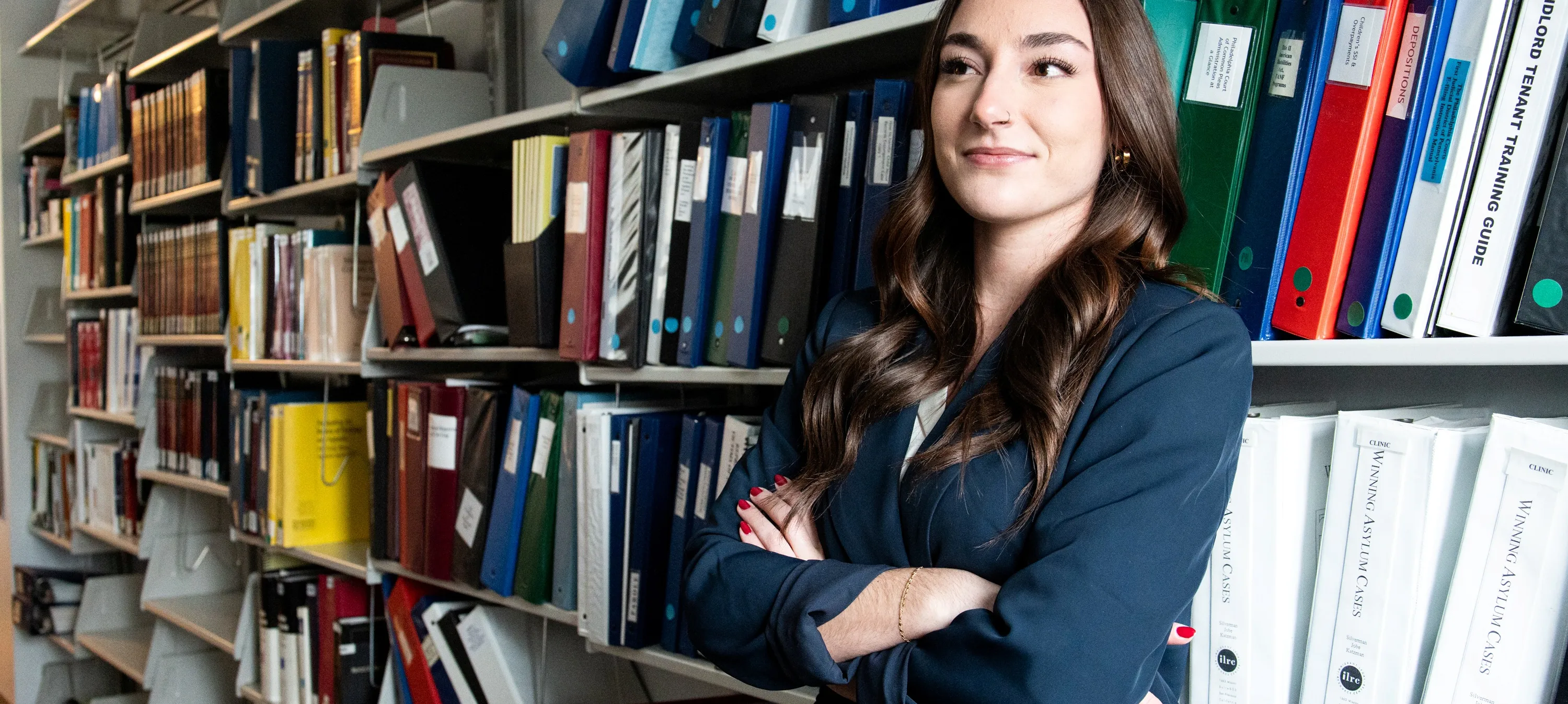 graduate student in front of graduate research resources