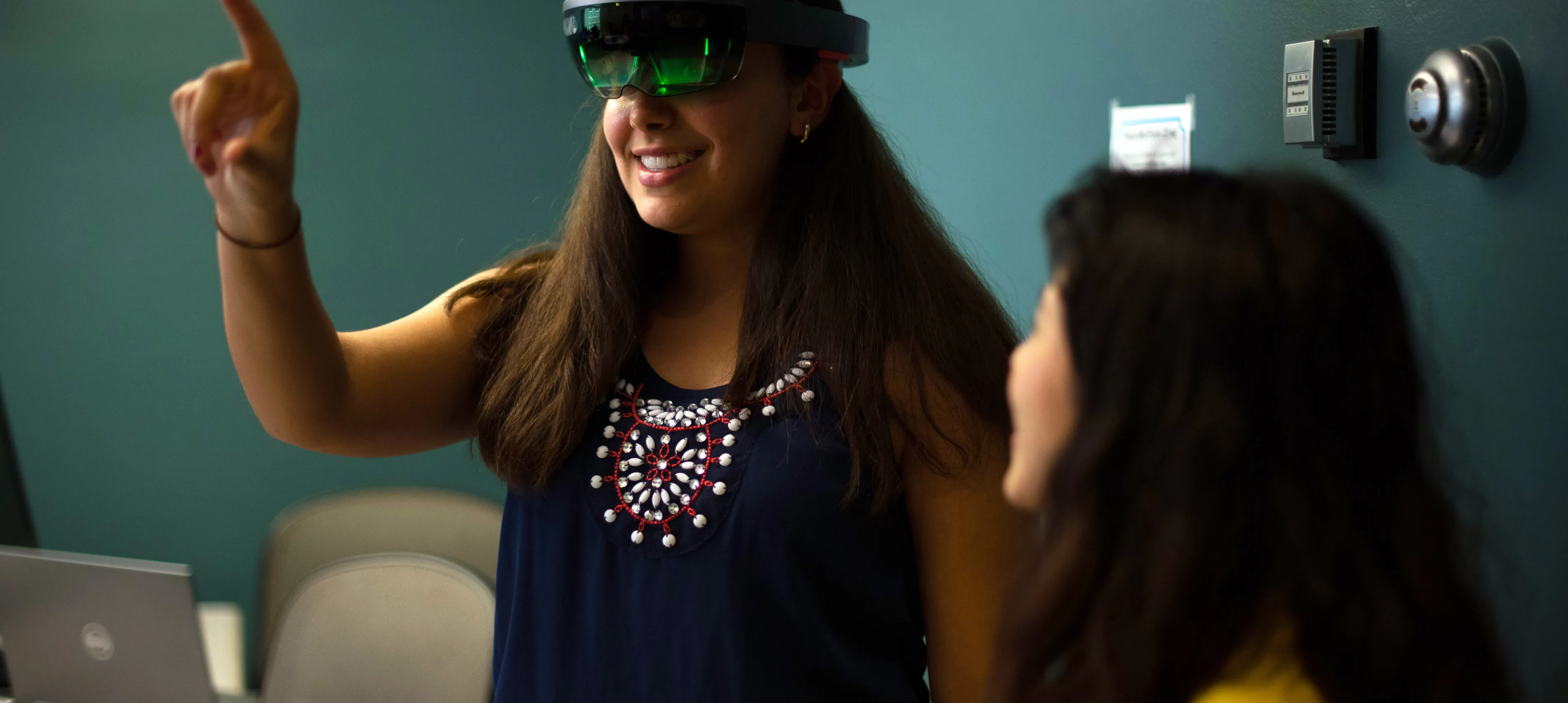 A woman works in virtual reality and computer science
