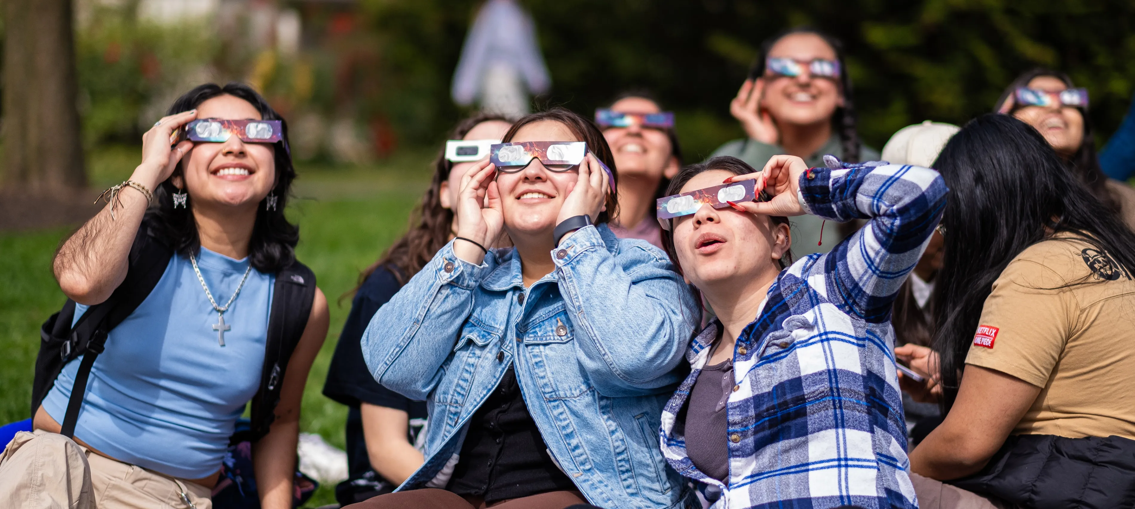 Bryn Mawr College students watch a solar eclipse