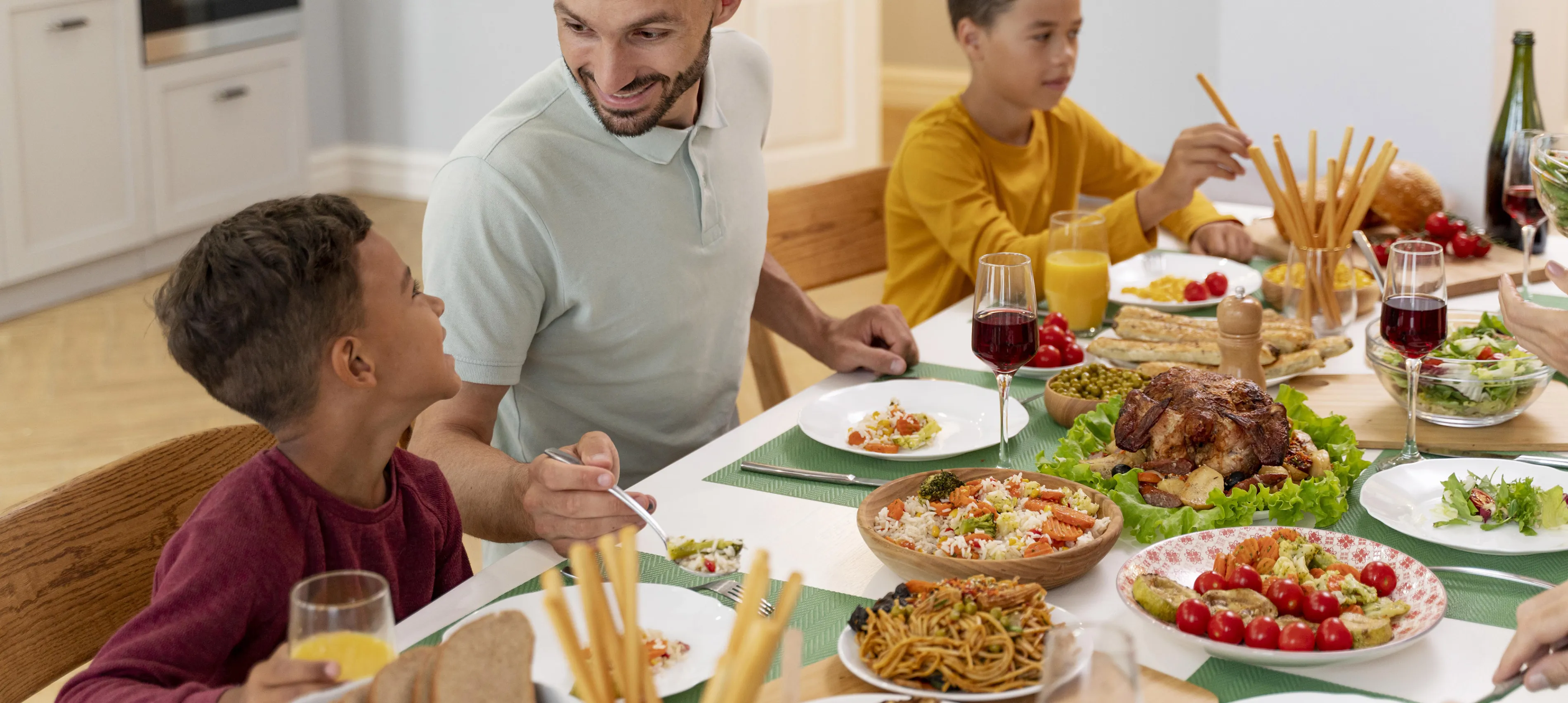 Happy family eats dinner