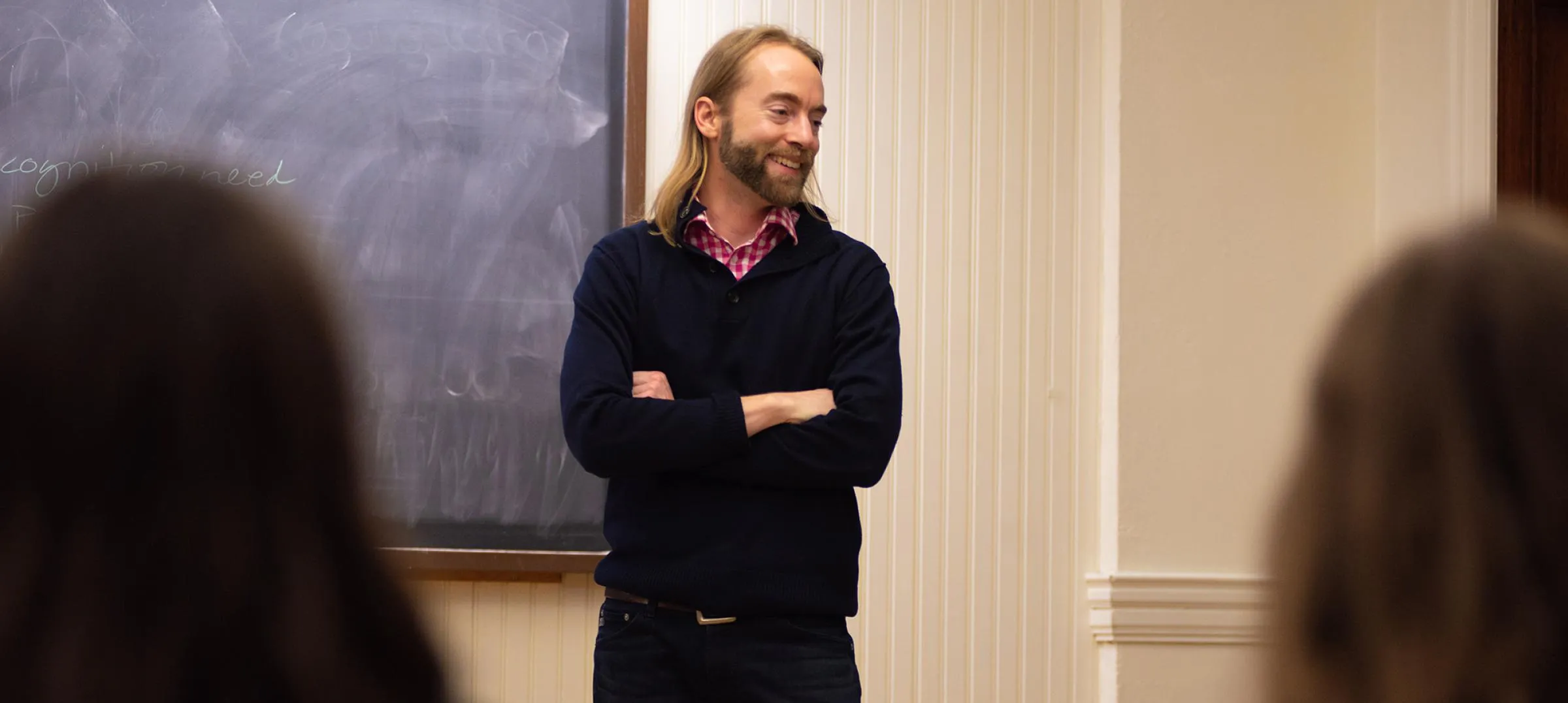 Joel Schlosser in classroom, engaging in research with students