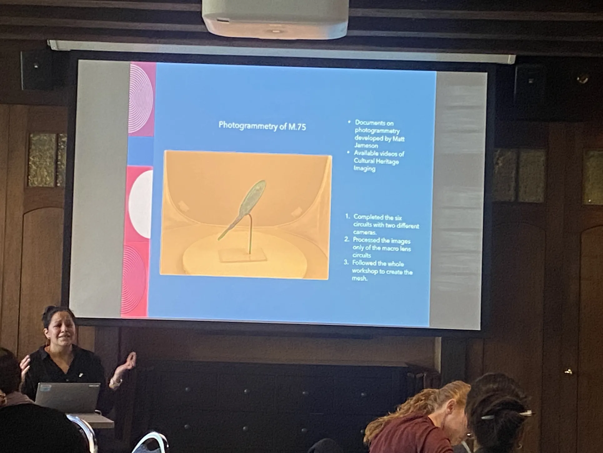 Illizt Castillo talks about using photogrammetry to capture ancient mirrors. An Etruscan mirror is on the project screen behind her