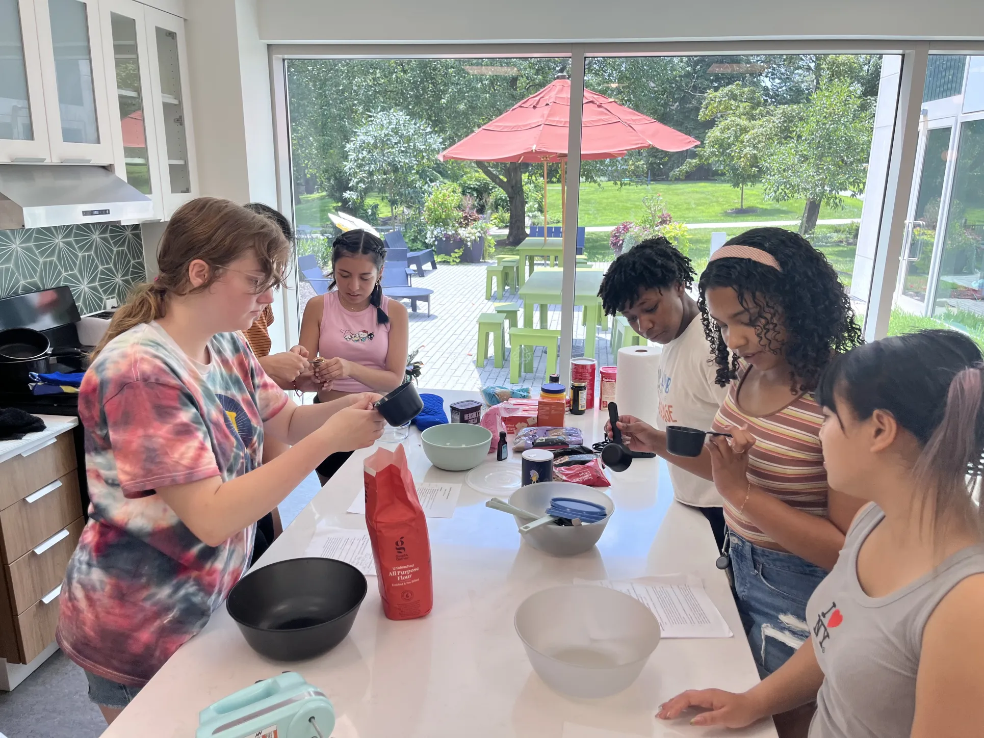 STEMLA Fellows prepare their recipes at the 2025 STEMLA Summer Bake-Off
