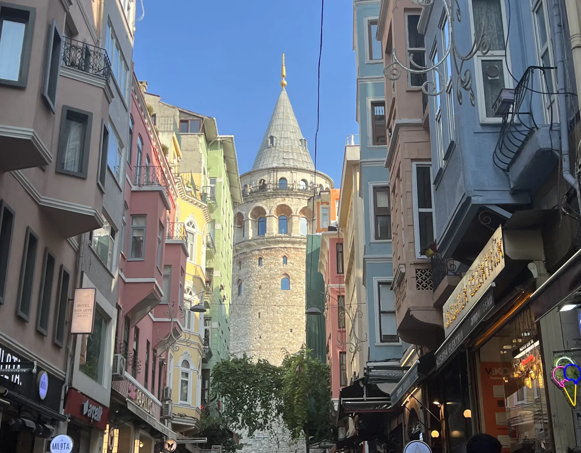 an image of a medieval tower rising above a more modern street in Istanbul
