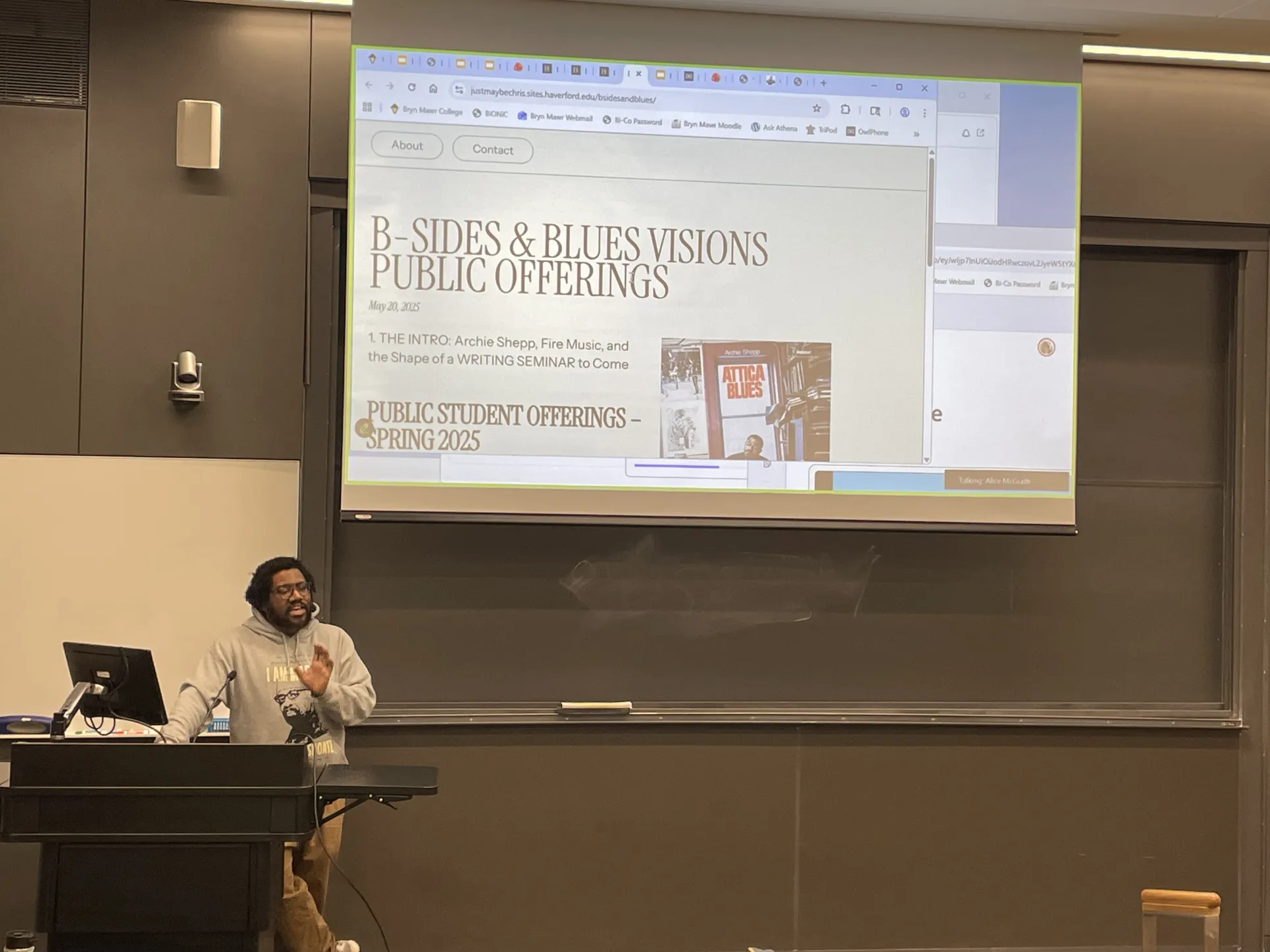 Chris Rogers, Visiting Assistant Professor of Writing, discuss a class website