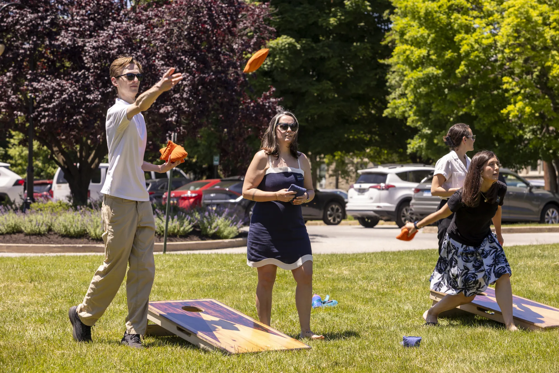 staff playing cornhole