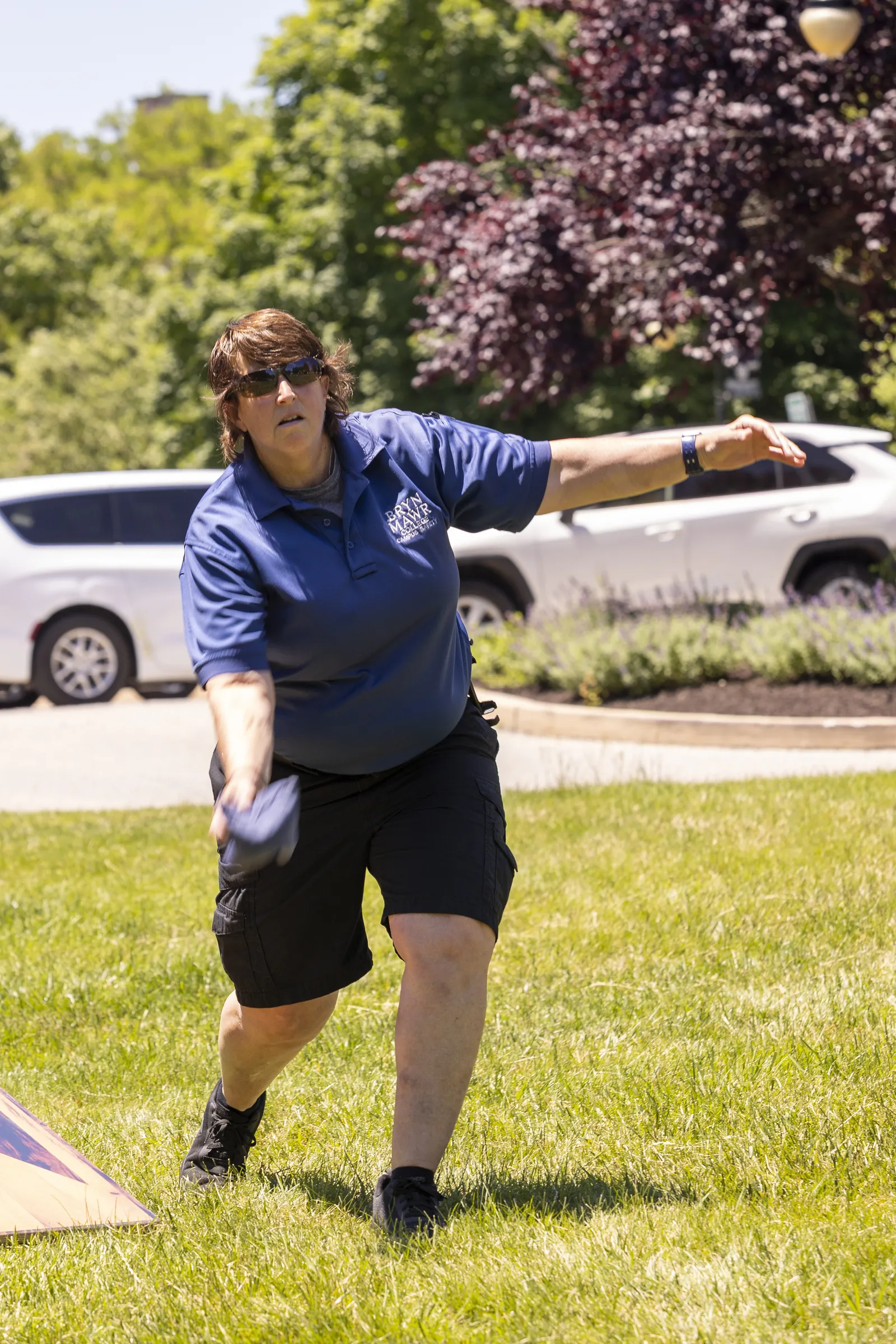 staff playing cornhole