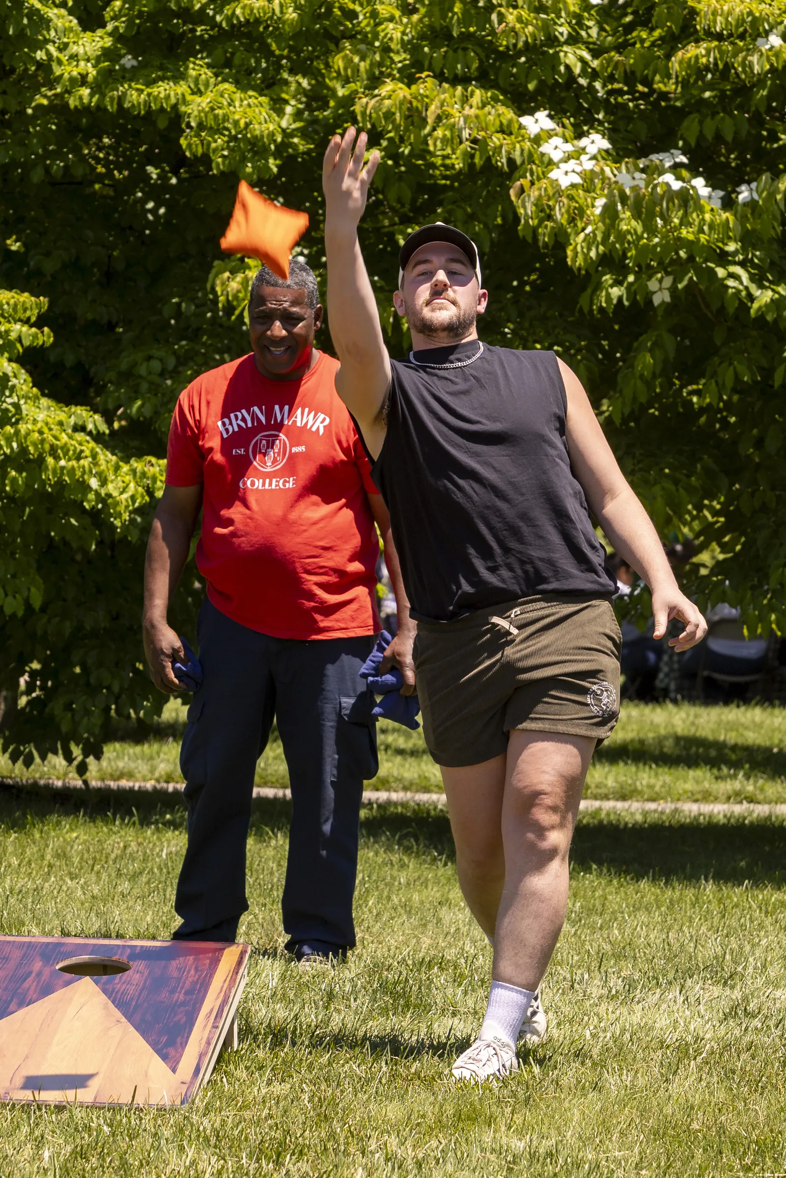 staff playing cornhole