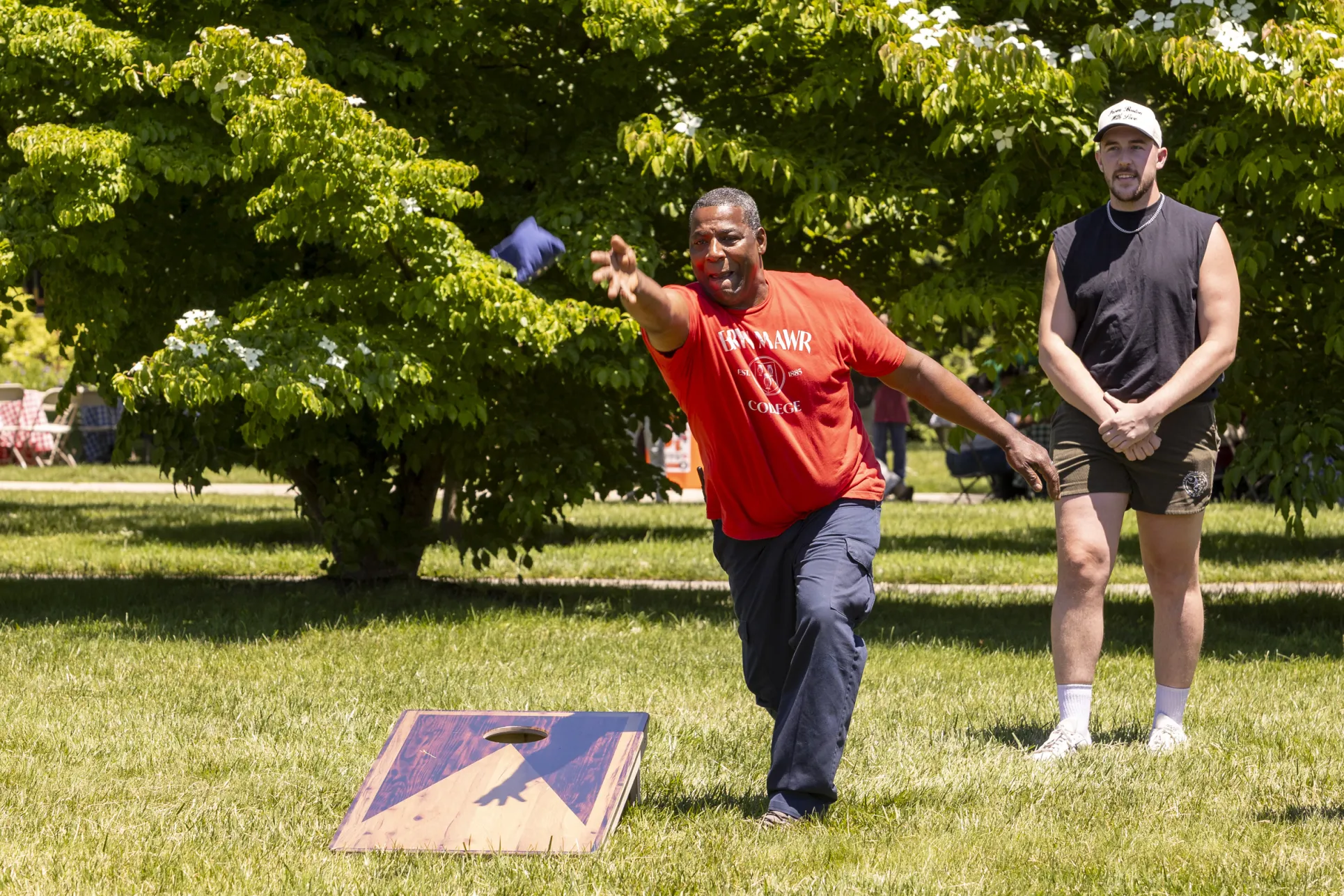 staff playing cornhole