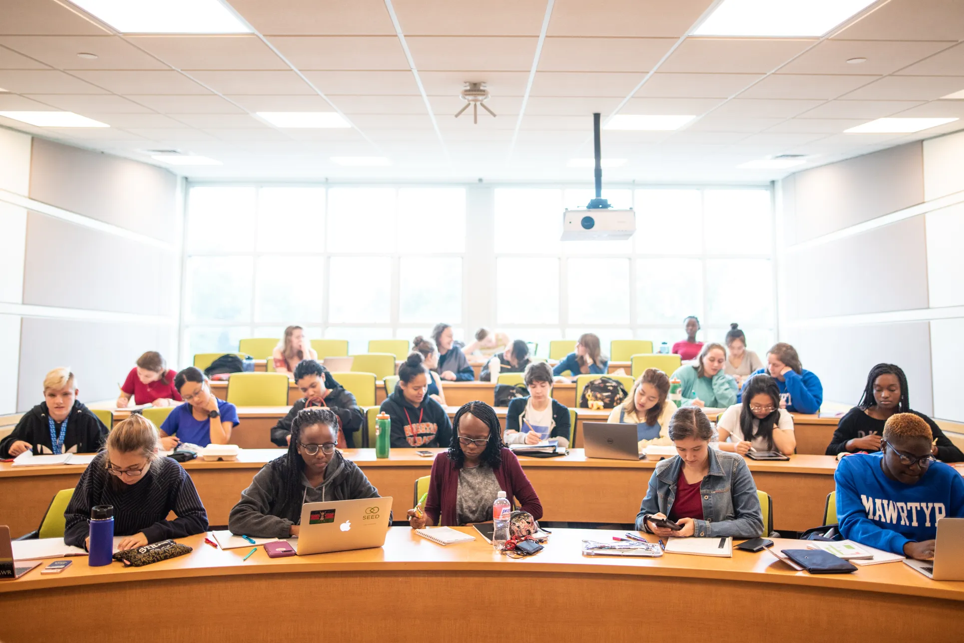 Physics Students take notes during a lecture