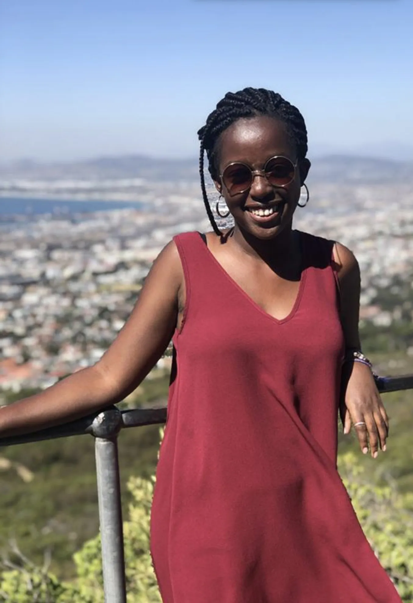 A Bryn Mawr College Student studying abroad poses overlooking Cape Town South Africa