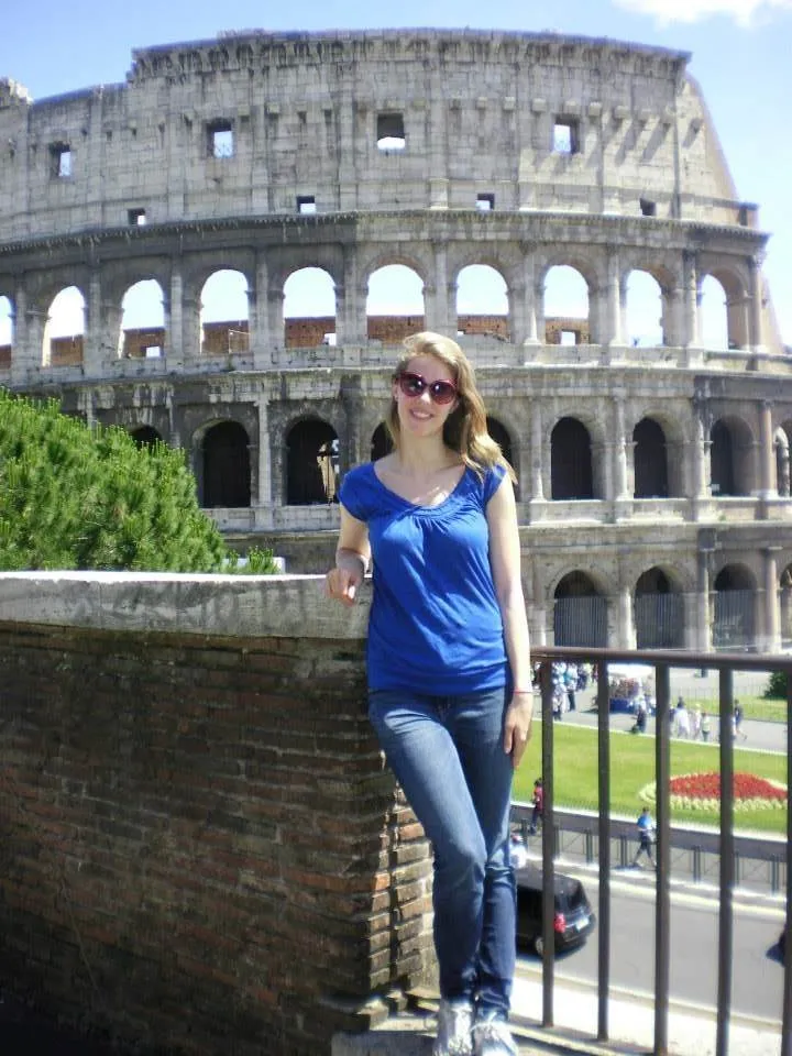 A Bryn Mawr College student studying abroad in Rome stands in front of the Colosseum