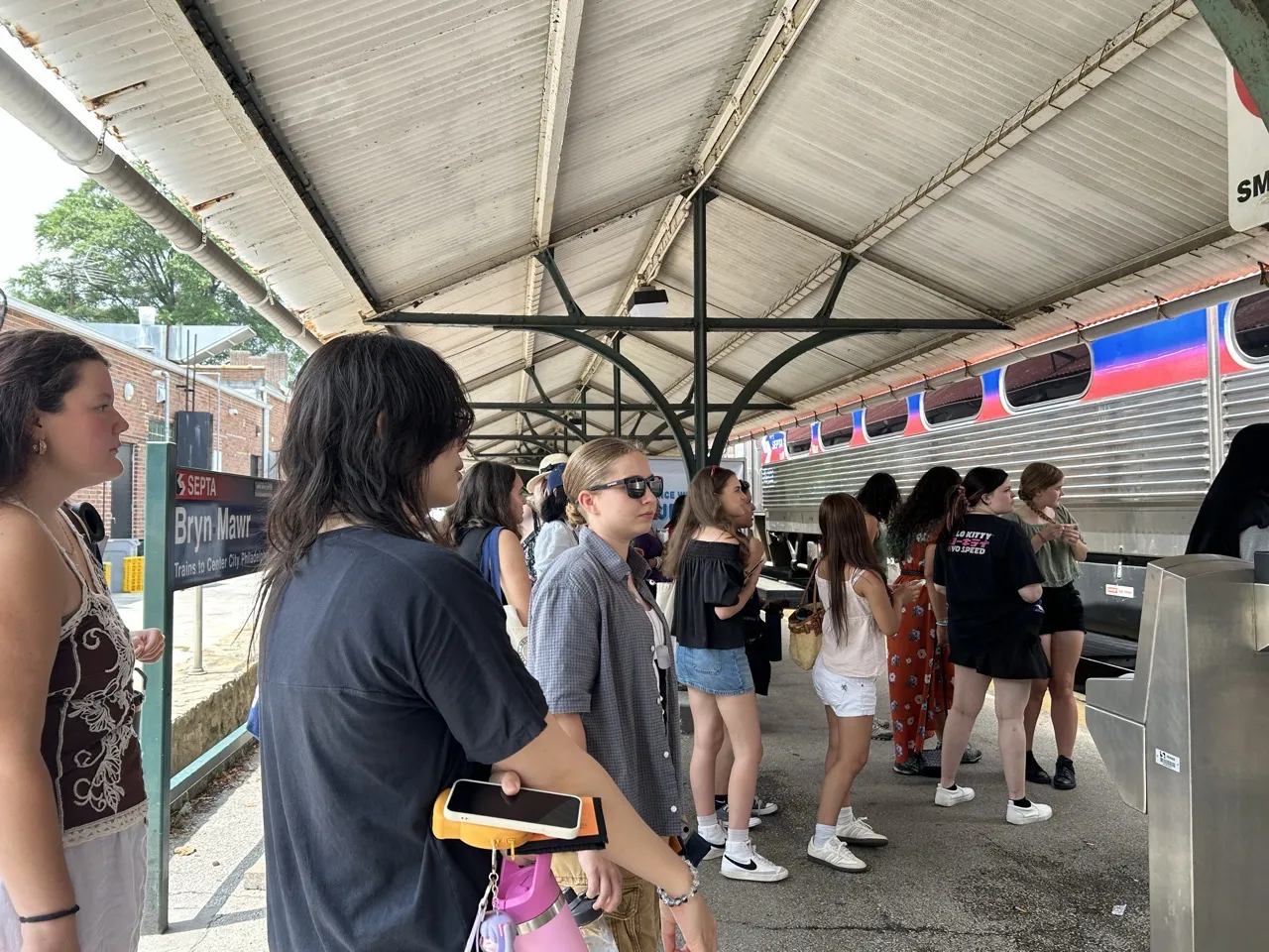 STEMLA Fellows wait for SEPTA on their way to the Franklin Institute during STEMLA summer 2026 program