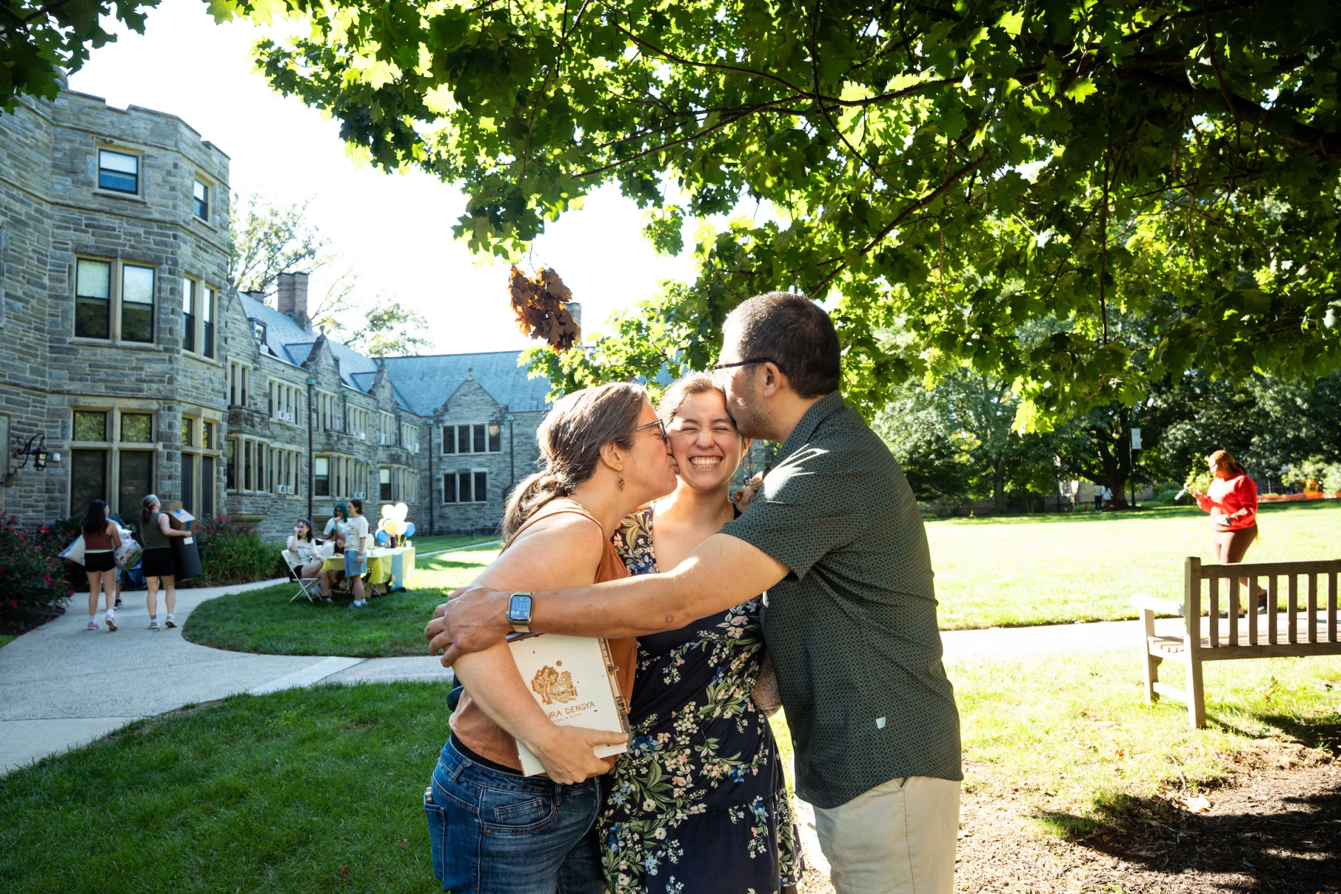 parent's hugging a student moving onto campu