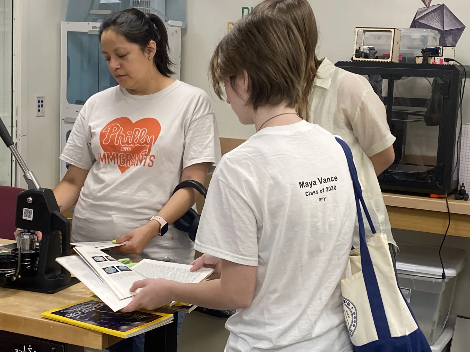 Students look at materials for collaging