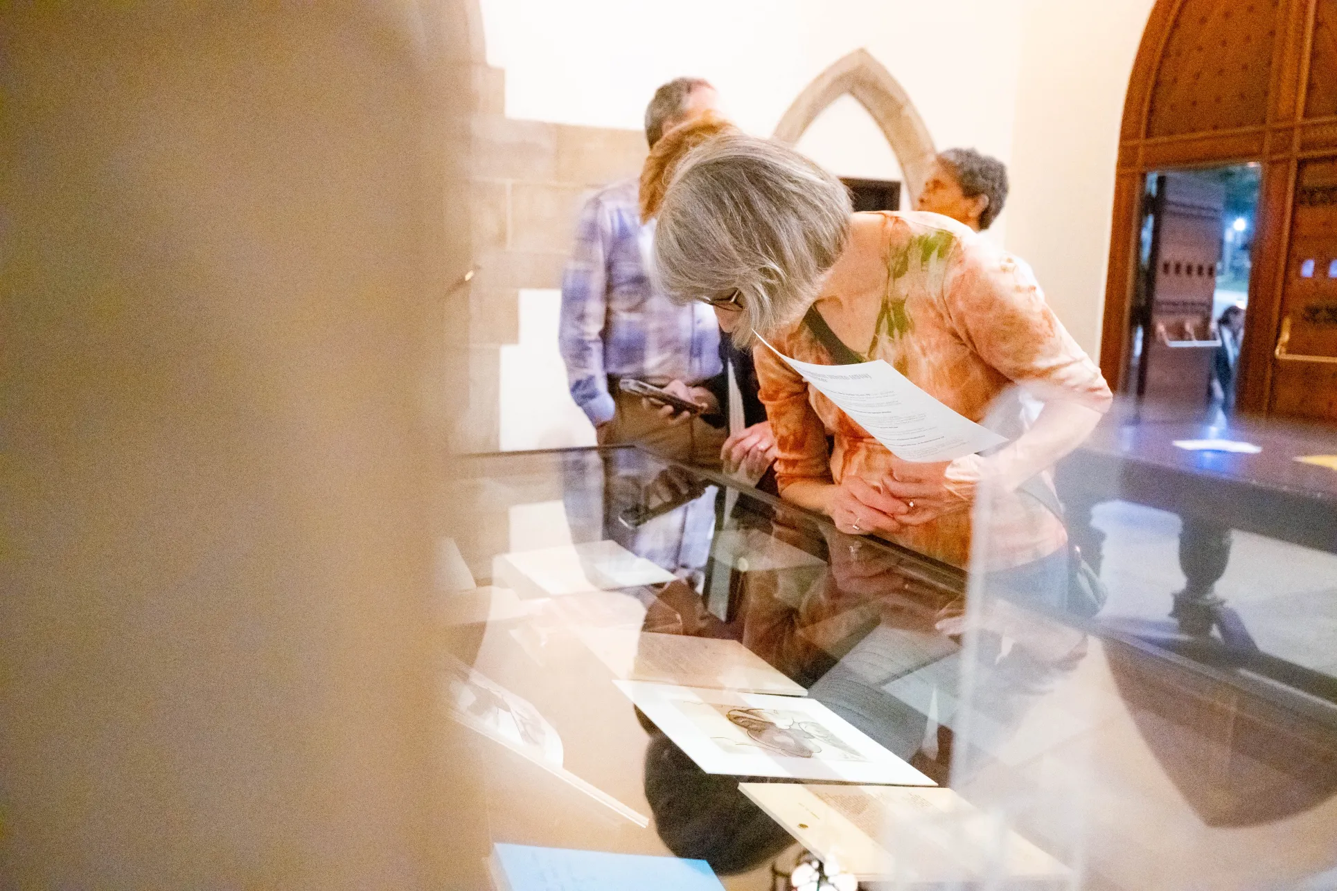 Attendees look at the curated exhibit of Katharine Sergeant White's papers. Photo by Alyson Bostrom ’28.