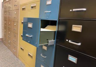 Photo of rows of filing cabinets.