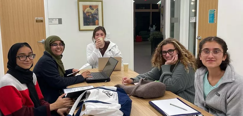 Image of students studying in The Well Kitchen at the Breaking Barriers Owl Night Study Night