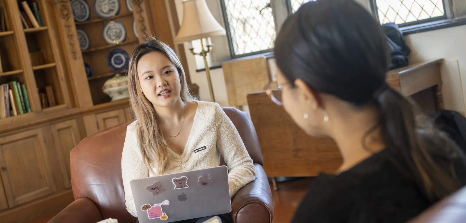 Two students talking to one another 