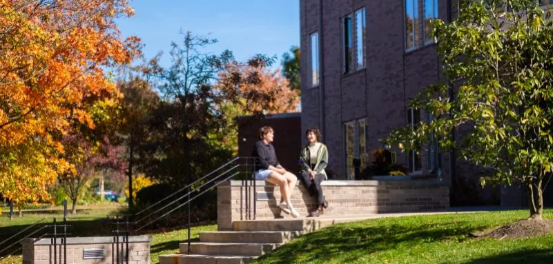 Students talking outside of New Dorm