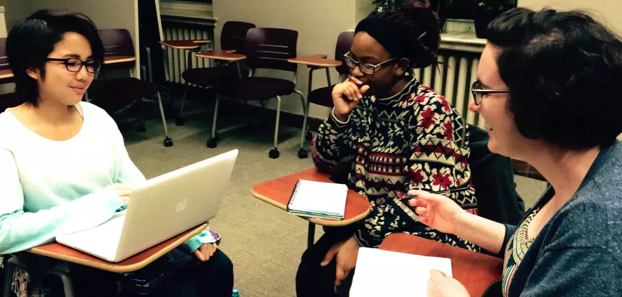 Faculty and students in conversation.