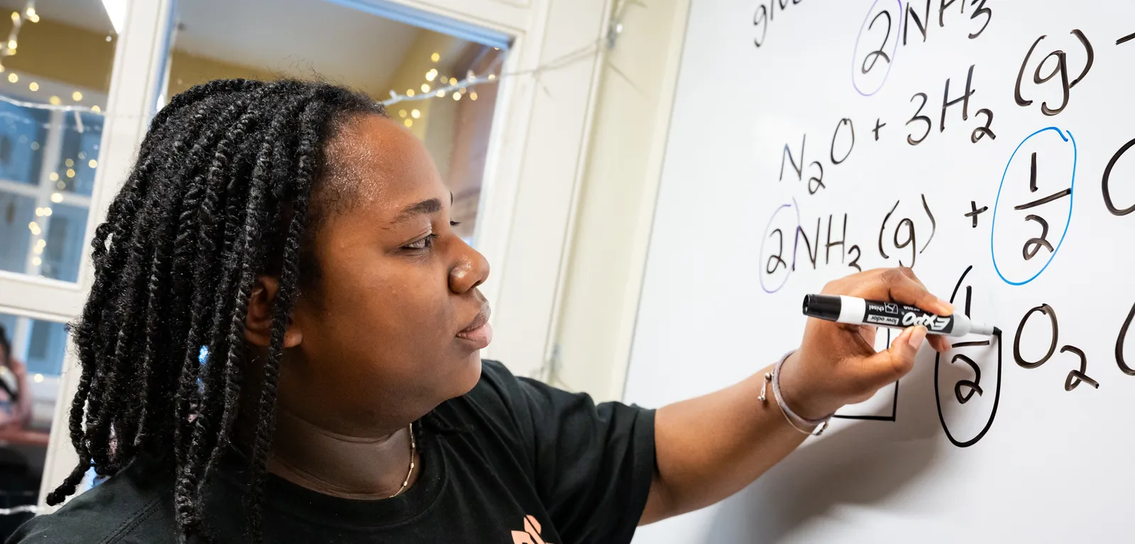 Student at Quantitative Center whiteboard