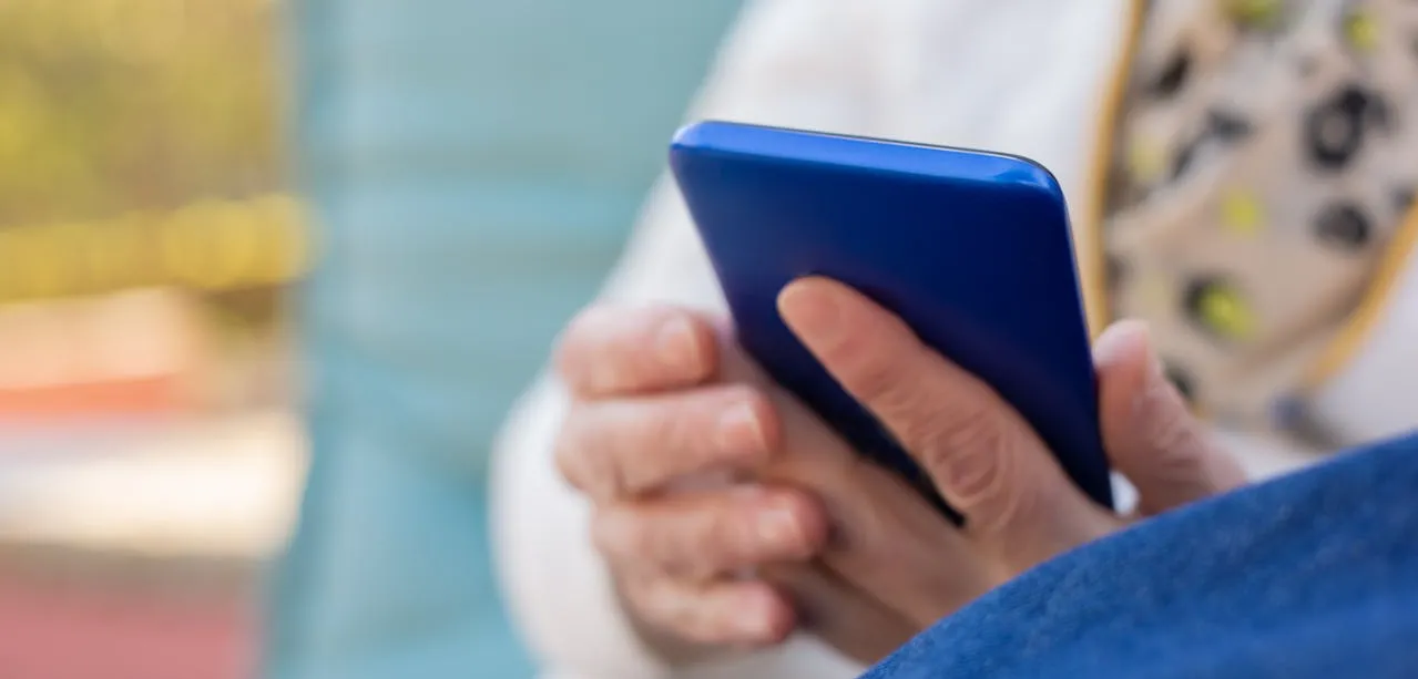 Holding blue phone in hands
