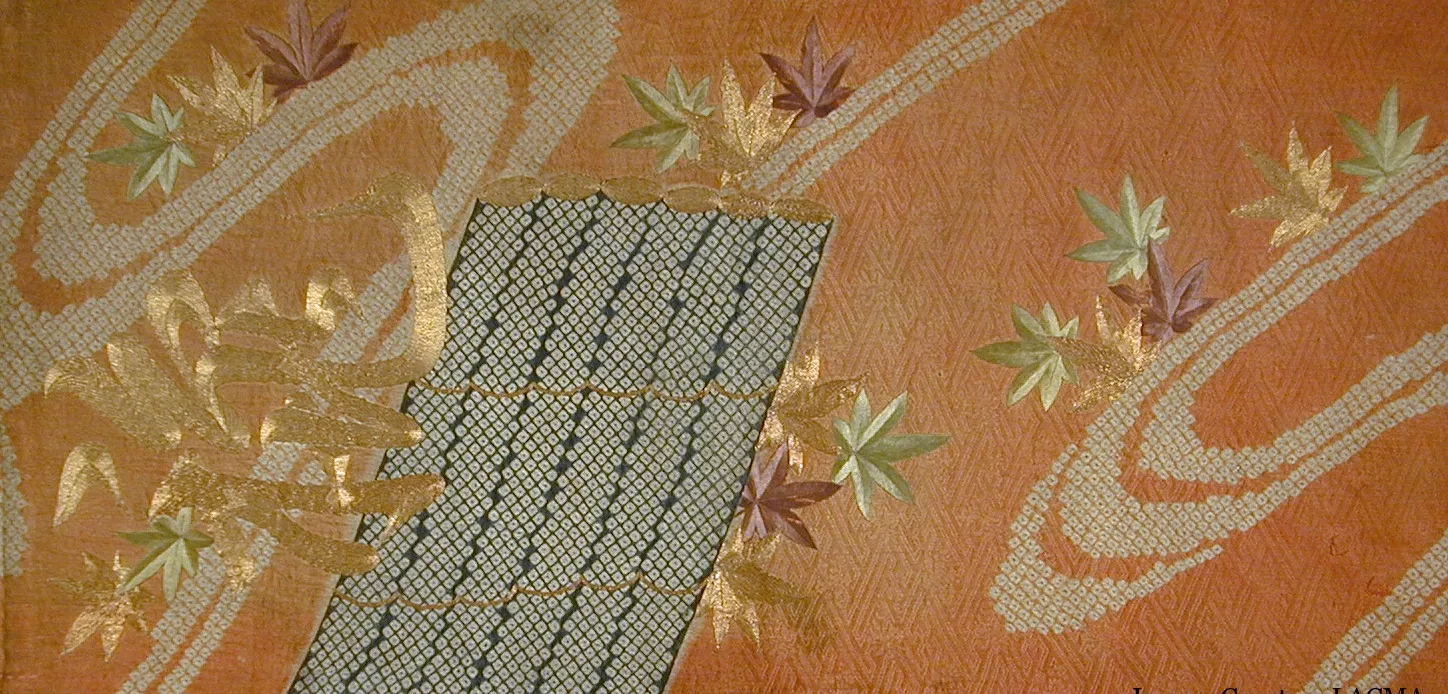 Orange fabric with embroidered embellishments